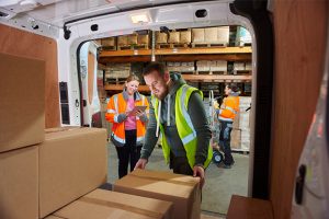 Team opening truck inside the warehouse of a freight forwarding company in Minneapolis