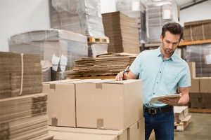 Man looking at a box