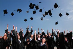 graduates throwing caps