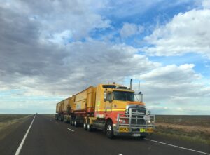 An image of a carrier shipping cargo on a highway