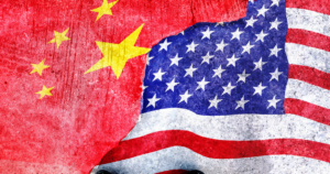 An image of flags overlapping for the United States and China