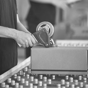 An image of a packaging being prepared to be shipped for an order.