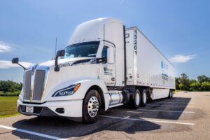 A truck in motion representing MVP Logistics' reliable and efficient trucking services in Minneapolis, emphasizing local expertise and seamless supply chain solutions.